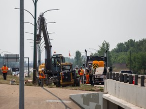 Construction crews worked in the southbound lane of Circle Drive at Eighth Street in Saskatoon on July 12, 2021.
