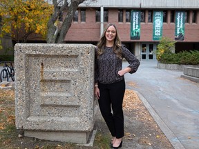 Whitney Curtis, who is a lab instructor for first-year students and an engineering graduate, stands in front of the College of Engineering on the University of Saskatchewan campus in Saskatoon on Oct. 13, 2021.