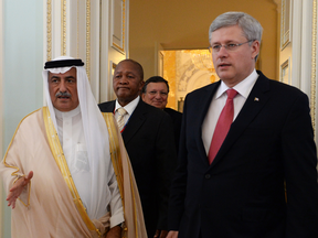 A 2013 photo of Prime Minister Stephen Harper with Saudi Finance Minister Arabia Ibrahim Abdulaziz Al-Assaf at a G20 summit in Russia. Until the end of the month, the former prime minister is on a tour of Middle Eastern nations, including Saudi Arabia.