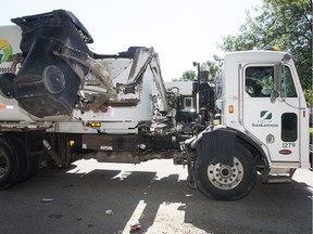 A garbage truck picks up a bin in Saskatoon in this 2013 photo.