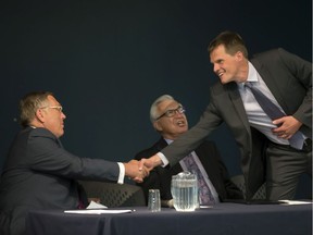 Three of the 28 men who have been elected Saskatoon mayor meet at a mayoral forum in September of 2016: from left, Don Atchison, Henry Dayday and Charlie Clark.