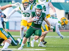 Huskies' running back Adam Machart takes the ball upfield during the team's last game at Griffiths Stadium, a 2019 playoff win over Alberta.
