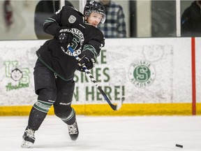 SASKATOON,SK--FEBRUARY 22/2020-0224 sports cw hockey- University of Saskatchewan Huskies defence Gordie Ballhorn passes the puck against the University of Calgary Dinos during 1st period game 2 action of the Canada West Men's Hockey semifinal at Merlis Belsher Place on the U of S campus in Saskatoon, SK on Saturday, February 22, 2020.