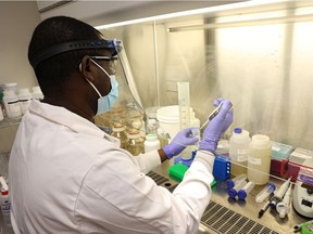 Dr. Femi Oloye prepares samples at the University of Saskatchewan's wastewater testing facility.