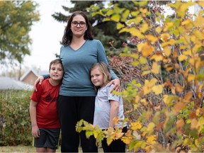 Anna Cole with her children, who attend Ecole Henry Kelsey School. It has a random draw to determine who gets rapid testing kits because there are not enough to go around.