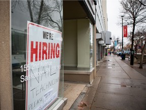 A help wanted sign hangs in a business window along Second Avenue. Photo taken in Saskatoon, SK on Thursday, October 14, 2021.
