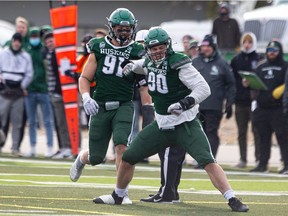 Huskies defensive lineman Nathan Cherry celebrates a play during Saturday's win over the Regina Rams.