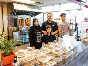 Wafaa Al Soua, left, stands with her husband Badie Al Souad and their two sons, Abdallah and Mohamad Alsouad in their restaurant, Taste of Syria, which opened in June, 2021. Photo taken in Saskatoon, SK on Thursday, October 28, 2021.