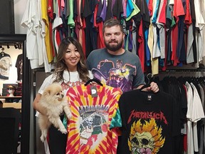 Kyle and Tina Marud (with their dog Mochi) at 4th Quarter Vintage, a store they opened in downtown Saskatoon in December 2020. They sell and buy vintage clothing of all sorts including shirts, jackets, sweaters, shoes and hats. They specialize in band shirts from the 80s and 90s and classic sportswear. Photo by Don Rice.