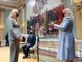 Canadian Prime Minister Justin Trudeau (C) looks on as Pascale St-Onge is sworn in as the Minister of Sport.