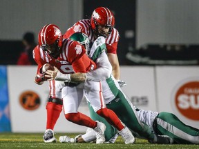 Saskatchewan Roughriders defensive tackle Makana Henry registers one of his team's four sacks of Calgary Stampeders quarterback Bo Levi Mitchell on Saturday.