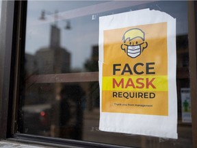 A face mask required sign is taped to a window of a downtown business in Saskatoon. Photo taken in Saskatoon on Thursday, September 9, 2021.