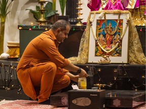 Volunteer leader Deepak Kausik prepares the Shri Lakshmi Narayan temple for a weekday service on Nov. 2, 2021. Diwali, the Hindu Festival of Lights, is celebrated this year on Nov. 4.