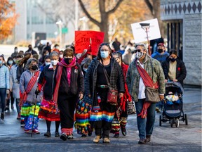 Demonstrators march at the U of S, part of a protest urging schools to take false claims to Indigenous identity seriously.