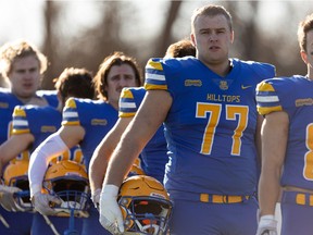 Jaxon Funk (77) lines up with his teammates prior to the PFC semifinal game between the Saskatoon Hilltops and Edmonton Huskies at SMF Field in Saskatoon on Sunday, November 7, 2021.