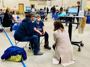 In photos provided by the Saskatchewan Health Authority, children 5-11 years old getting the COVID-19 vaccine at the Regina clinic. The SHA did not provide names for any of the people in the images.