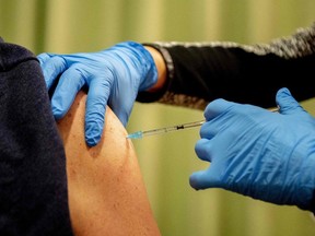 Some experts are recommending the booster vaccination as extra protection against hospitalization due to the coronavirus. (Photo by ROBIN UTRECHT/ANP/AFP via Getty Images)