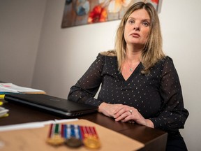 Retired MCpl. Amy Green poses for a portrait at her workspace in London, Ont., Friday, Nov. 5, 2021.