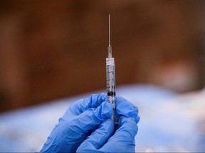 A syringe is filled with a dose of Pfizer's COVID-19 vaccine at a pop-up community vaccination center at the Gateway World Christian Center in Valley Stream, New York, U.S., February 23, 2021.