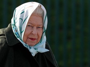 (FILES) In this file photo taken on February 5, 2020 Britain's Queen Elizabeth II reacts during her visit to Wolferton Pumping Station in Norfolk, east of England. - Queen Elizabeth II has a "sprained back" and will miss Sunday's Remembrance service -- her first planned public appearance since resting on medical advice, Buckingham Palace said.