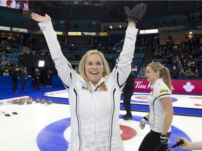 Skip Jennifer Jones celebrates after guiding her team to a 6-5 extra end win over team Fleury to capture the woman's Olympic curling trials. Curling Canada/ Michael Burns Photo