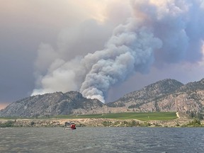 Smoke billows from a wildfire near Osoyoos, B.C., on July 19, 2021, in this picture obtained from social media.