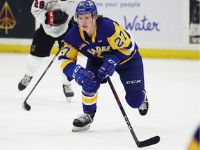 Saskatoon Blades defender Pavel Bocharov carries the puck up the ice during first period WHL action against the Moose Jaw Warriors in Saskatoon on Wednesday, Oct. 27, 2021.