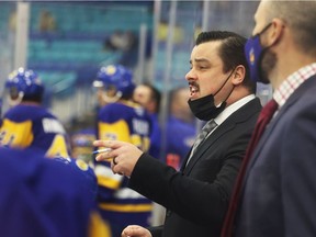 Saskatoon Blades head coach Brennan Sonne directs orders from the bench during first-period WHL action against the Moose Jaw Warriors in Saskatoon on Wednesday, October 27, 2021.