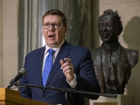 A bust of Tommy Douglas, founder of government funded health care, stands behind Premier Scott Moe as he provides an update on COVID-19 in Saskatchewan at  the Legislative Building on Thursday, December 16, 2021 in Regina.

TROY FLEECE / Regina Leader-Post