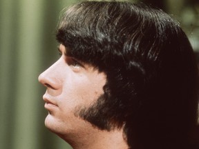 In this file photo taken in 1968, Michael Nesmith, a guitarist with the manufactured American pop group The Monkees, displays his fashionable sideburns.