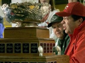Saskatchewan Huskies' head football coach Brian Towriss, left, and Laval head coach Glen Constantin, right, answer questions during the coaches news conference at the 2004 Vanier Cup. (CP PHOTO/J.P. Moczulski)