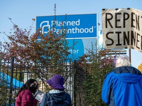 Protesters and clinic volunteers speak outside a Planned Parenthood location in Columbus, Ohio. Saskatchewan could become the latest province to create protest-free buffer zones around facilities where abortions are performed.