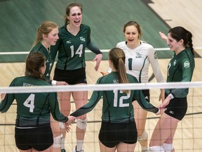 The University of Saskatchewan Huskies celebrate against the University of Alberta Pandas during Canada West women's volleyball action at the PAC on the U of S campus in Saskatoon on Saturday, February 8, 2020.