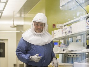 Darryl Falzarano works in the level 3 containment lab at VIDO.