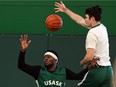 Alexander Dewar, right, gets up to receive a pass in front of teammate Marquavian Stephens during a University of Saskatchewan Huskies men's basketball practice at Merlis Belsher Place.
