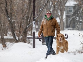 Tim Myrfield and his dog Charlie walk along the Meewasin Trail in Saskatoon on Jan. 13. Discussions are underway about a partnership with the federal government to turn the Meewasin Valley into a national urban park.