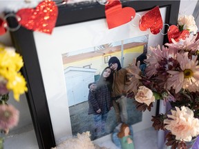 A makeshift memorial for Kira Opoonechaw and Phoenix Checkosis, the two victims of a double homicide in the 400 block of Avenue B North in Saskatoon on Jan. 21, 2022.