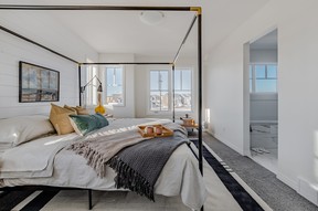 Each unit at the Waterfront Towns offers three bedrooms, including a spacious owners’ suite. A painted shiplap feature wall crafted from textured knotty pine adds designer style to the primary bedroom. SUPPLIED PHOTO