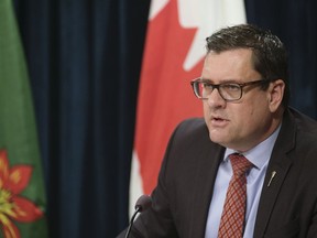 Health Minister Paul Merriman speaks during a press conference at the Legislative Building.