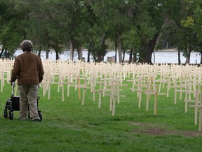 Row upon row of wooden crosses meant to represent the lives lost in Saskatchewan to drug overdoses.