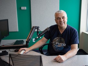 Brent Loucks sits for a photo in his Rawlco studio where he aired his final morning show after 40 years on the airwaves. Photo taken in Saskatoon, Feb. 4, 2022.