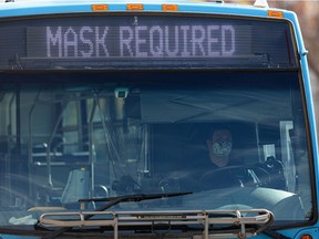 A masked bus driver waits for passengers at the downtown bus mall. Photo taken in Saskatoon on Friday, Sept. 24, 2021.