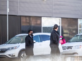 Lighthouse board member Adeel Salman exits the downtown building. Former employees said Salman terminated some of them Tuesday while accompanied by a security guard.