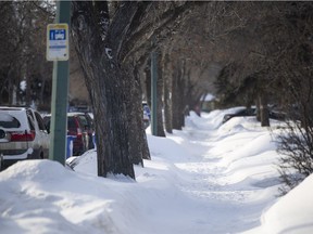 A snowy sidewalk in a residential neighbourhood on Scott street on Wednesday, February 16, 2022 in Regina. KAYLE NEIS / Regina Leader-Post