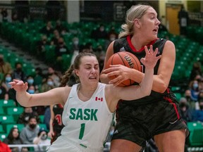 University of Saskatchewan Huskies guard Libby Epoch, left, collides with University of Wesmen forward Keylyn Filewich, right, during the first quarter USport Canada West women's basketball action at Physical Activity Complex in Saskatoon on Friday, February 18, 2022.