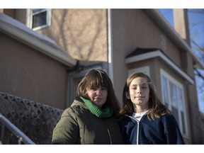 Karlie King and her 11-year-old son Reuben King Kimball stand for a portrait outside their home on Feb. 25, 2022 in Regina.