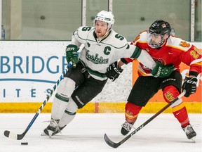 SASKATOON, Sask.--FEBRUARY 25/2022- 0226 sports huskies men's hockey- University of Saskatchewan Huskies defence Gordie Ballhorn (3) skates with the puck as Univeristy of Calgary Dinos defence Josh Rieger (22) looks on during the first period of U Sports Canada West men's hockey playoff action at Merlis Belsher Place in Saskatoon, Sask. on Friday, February 25, 2022.