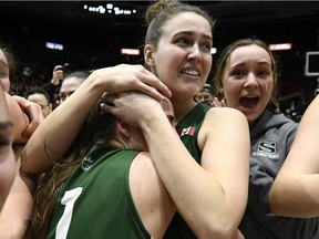 University of Saskatchewan Huskies forward Janaya Brown (13) hugs guard Libby Epoch (1) as they celebrate their victory over the Brock Badgers after the second half of the women's championship final basketball game of the U Sports Final 8 Championships, in Ottawa, on Sunday, March 8, 2020.
