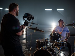 Prehistoric Productions owner and operator Brad Pederson at work, filming a music video with W3APONS in Regina.