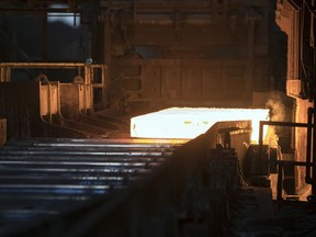 A slab of steel comes out of the furnace at an approximate temperate of 2300 degrees fahrenheit at Evraz in Regina.